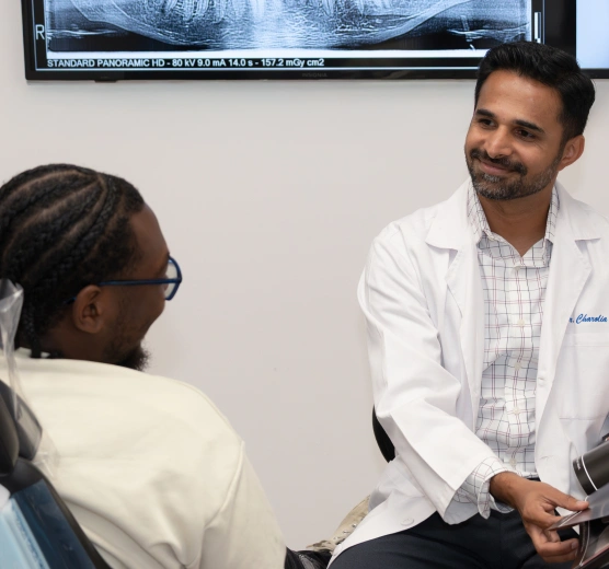 Dentist discussing dental sealants with a patient