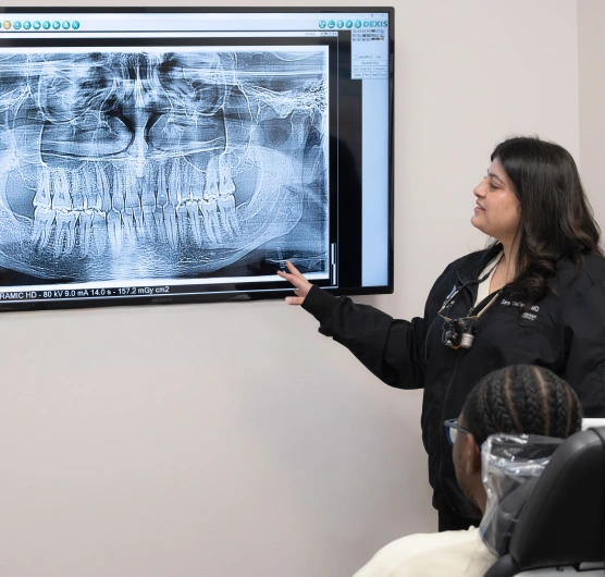 Dentist reviewing a patient's dental X-ray