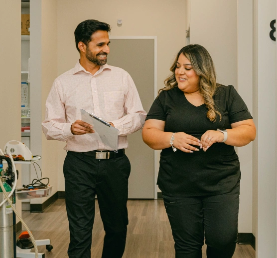Dental team members walking together in a dental office