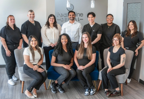 Group photo of a dental team standing together