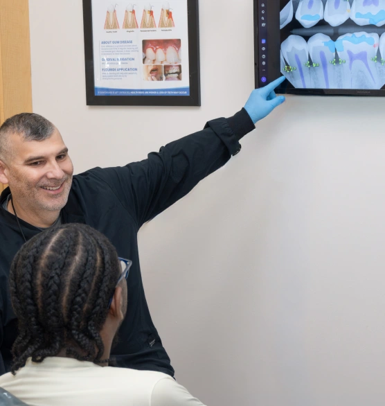 Dentist explaining root canal therapy to a patient