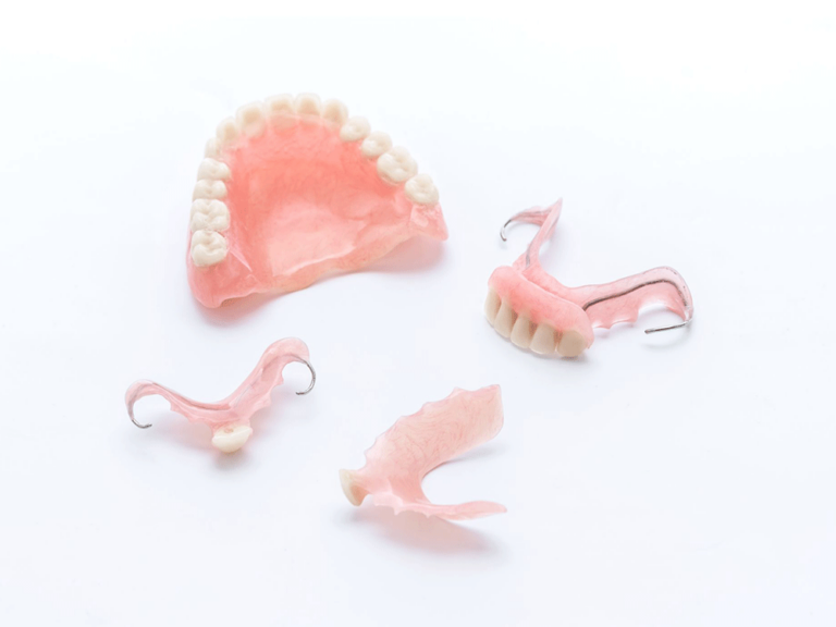 different types of dentures on white background