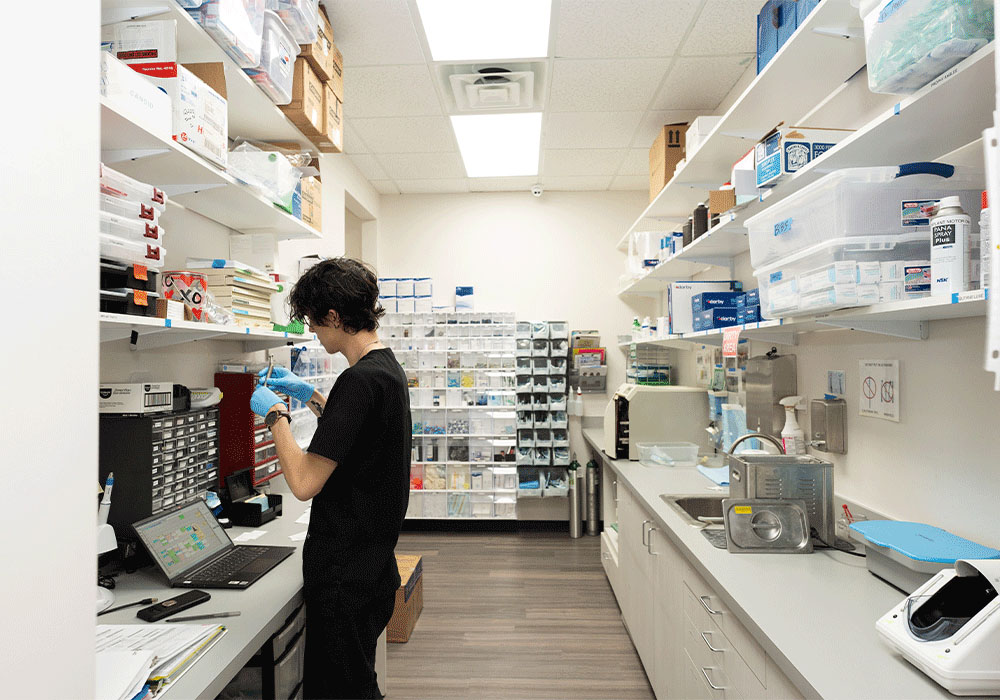 Assistant in the back office working with equipment and charts